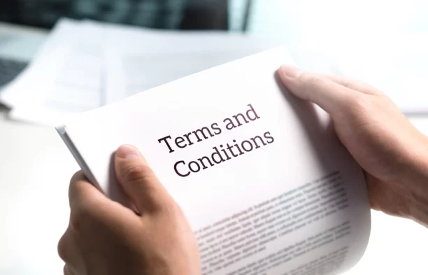 A person reading terms and conditions for TxWireless