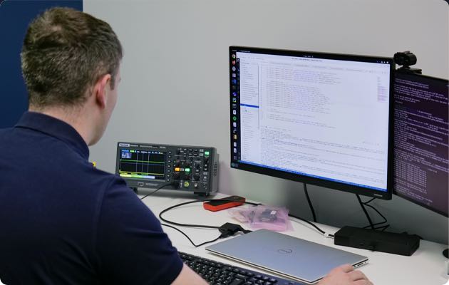 a engineer working on a software for a IoT device